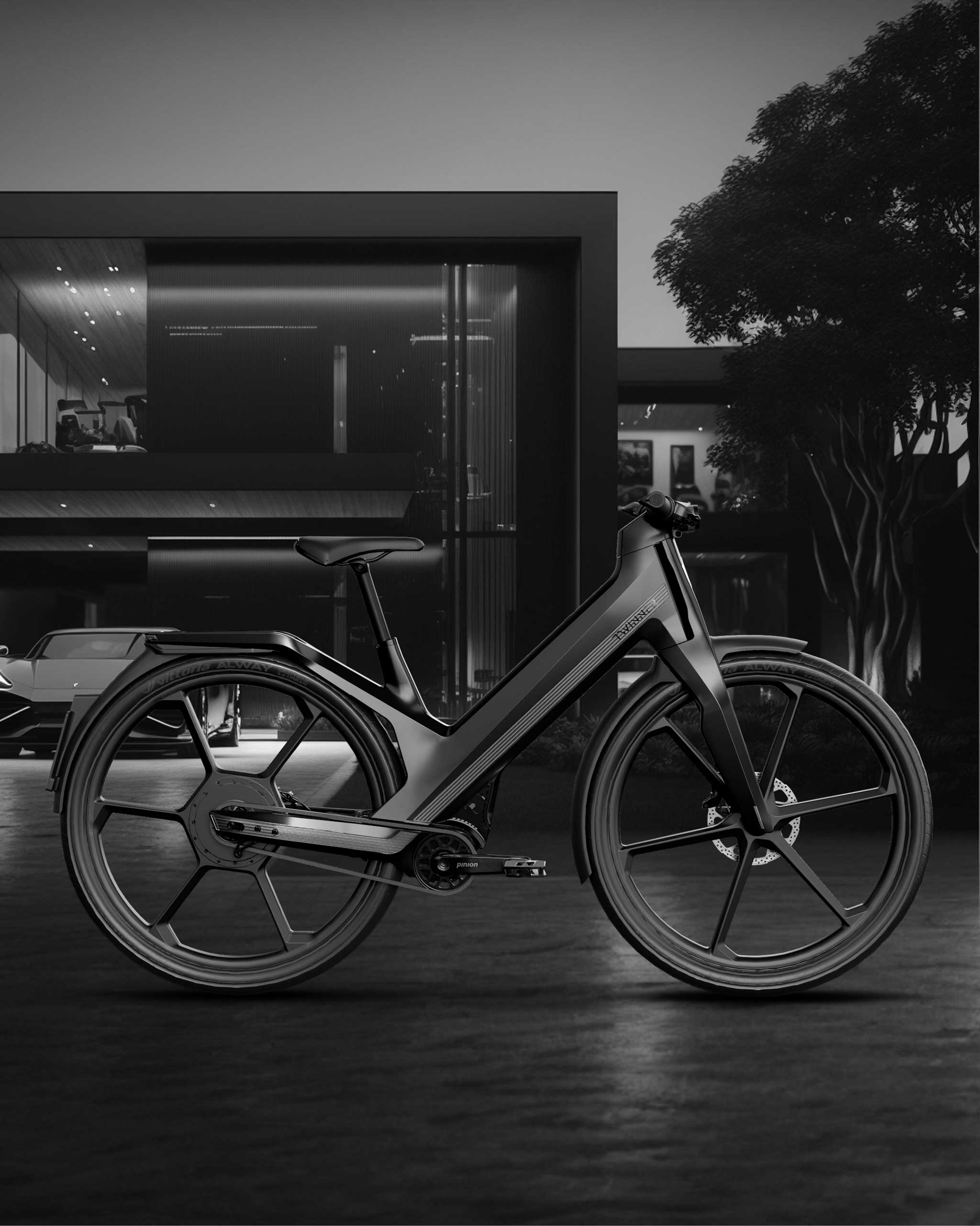 Twinner E-Bike schwarz vor Design Haus